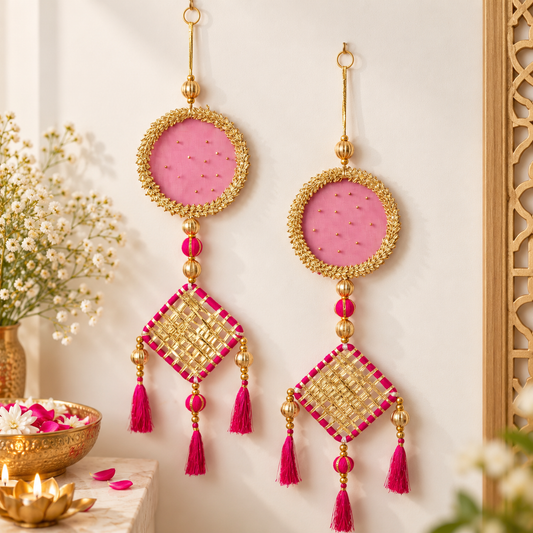 Pink and gold decorative wall hanging set with circular fabric accents, golden bead detailing, and pink tassels for festive home decor