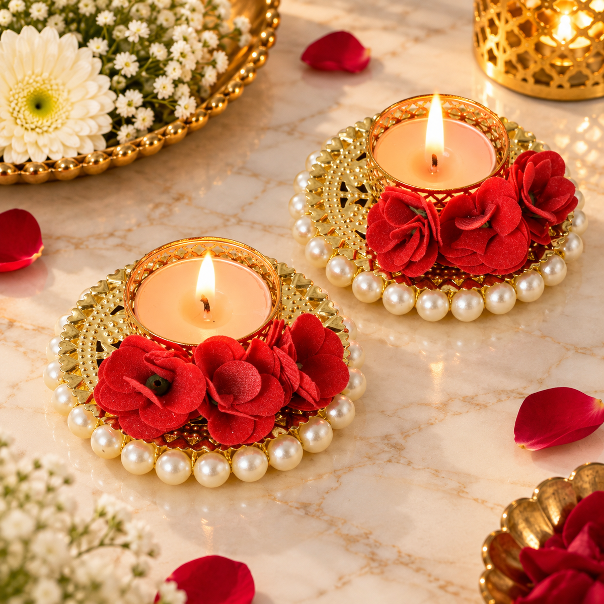 Two red rose decorative T-light candle holders with golden bases and pearl borders, styled for Diwali and festive pooja decor.